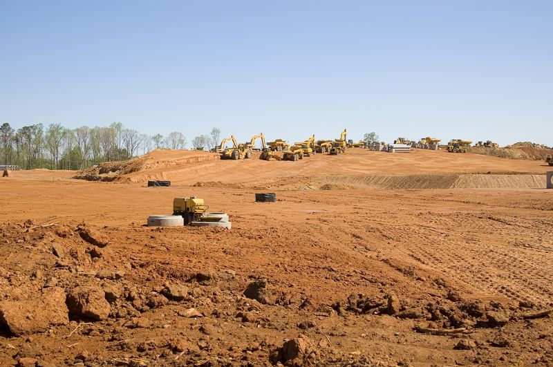 Prepares land for development